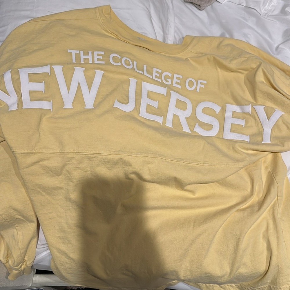 The College of New Jersey yellow long sleeve.